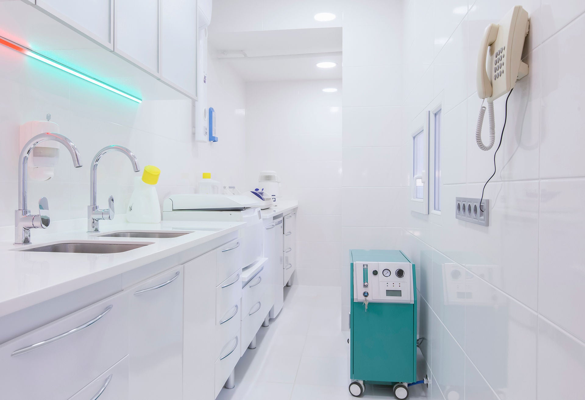 Tool disinfection room in modern dental office, full sterilization, white interior, copy space, professional equipment
